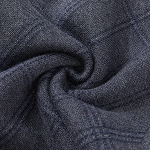 Detailed close-up of dark grey knitted fabric texture on men's casual sleeveless sweater