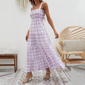 Detail of purple gingham maxi dress featuring smocked bodice and tiered flowy skirt