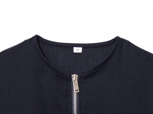Close-up of linen blend safari jacket neckline with silver zipper and size S tag