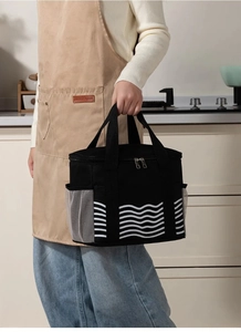 Close-up of black insulated lunch bag with wave pattern and mesh side pockets