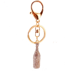 Golden sparkling wine bottle keychain with crystals and lobster clasp for bags