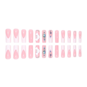 French tip press-on nails with 3D floral accents and rhinestones in pink and white