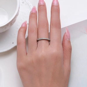 Elegant S925 sterling silver eternity ring with micro-pave crystals on female hand