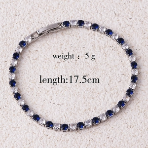 Detail of silver tennis bracelet with alternating blue and white zircons, 17.5cm length