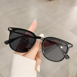 Classic black square frame sunglasses with dark grey lenses and unisex oversized design