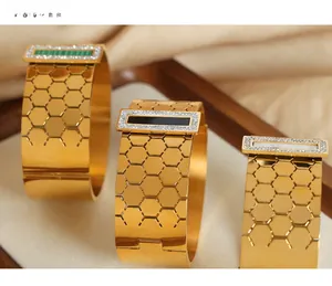 Detailed view of honeycomb texture gold bracelets with malachite and onyx stone inlays