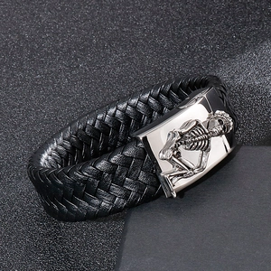 Men's wide braided leather bracelet with stainless steel skull clasp in punk style