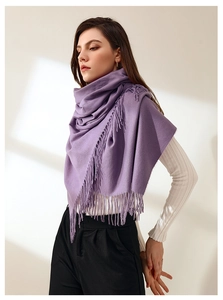 Detail of purple faux cashmere scarf showing soft texture and long fringe tassels
