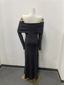 Detail of dark grey ribbed knit fabric on long off-the-shoulder elegant dress
