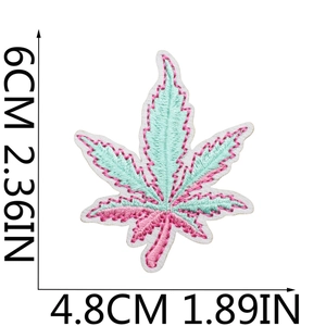 Close-up of pink and green maple leaf embroidery patch with detailed size dimensions