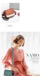 Detail of color-block crossbody bag with wide striped strap and bear charm