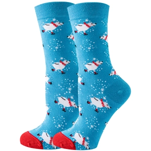 Detail of blue socks featuring polar bears skating and red heels on a white background