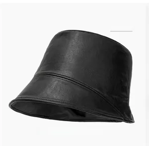 Detail shot of black PU leather bucket hat showing premium texture and neat stitching