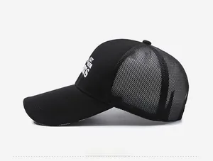 Detail view of black mesh baseball cap showing breathable net and outdoor sports embroidery