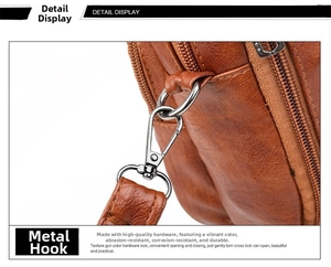 Détail de la quincaillerie en métal et de la texture cuir grainé sur le sac à bandoulière