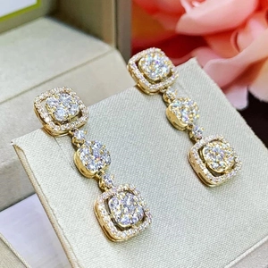 Luxurious gold three-tier square drop earrings with shimmering micro-pave crystals