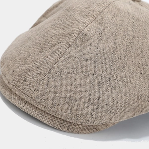Close-up of the breathable linen texture and stitching on this vintage newsboy cap