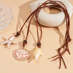 Seaside vacation necklace with starfish, pink shell and conch pendants on brown leather cord