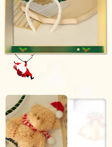 Close-up of plush Christmas headband with cute teddy bear pendant and ribbon streamer
