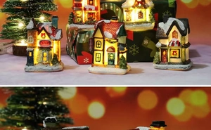 Detailed close-up of LED glowing resin Christmas village houses with snowy rooftops