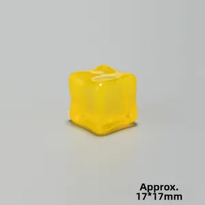 Macro view of a 17mm yellow translucent resin ice cube decor with a wavy texture