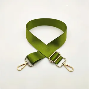 Adjustable green nylon strap with gold lobster clasps for shoulder bags and crossbody use