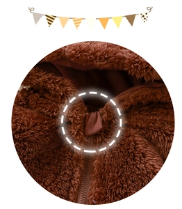 Detailed macro view of high-quality brown plush fabric with a sturdy zipper closure
