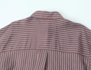 Detailed close-up of the back yoke and stripe pattern on this brown cotton poplin shirt