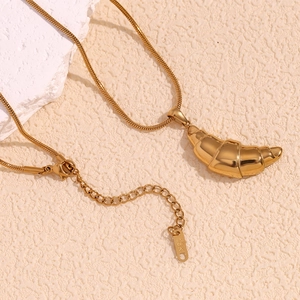 Detail of 18K gold plated croissant pendant showing the lobster clasp and snake chain