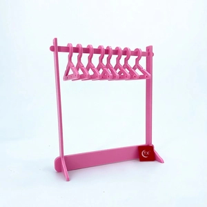 Pink acrylic jewelry organizer with mini coat hangers for earrings and necklace storage