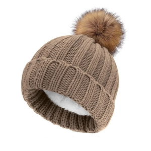 Winter knitted beanie in dark khaki with a faux fur pompom and warm fleece lining