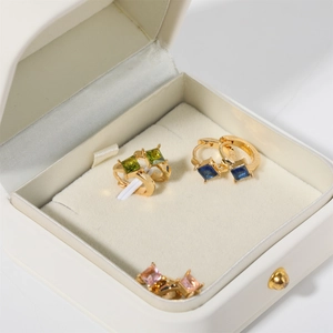 Three pairs of elegant square gemstone earrings in green, blue, and pink on gold bases