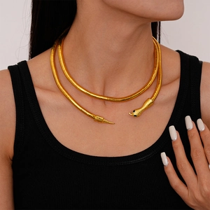 Golden snake-shaped double wrap necklace with black gemstone eyes and scaled texture