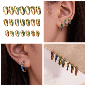 Detail of snake hoop earrings with multi-colored crystals and 18k gold plating