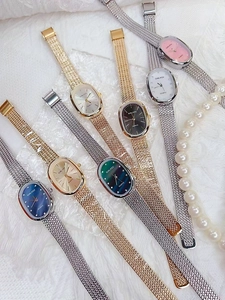 Elegant collection of oval quartz watches with mesh bands and diamond hour markers