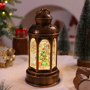 Vintage bronze Christmas lantern with glowing mini tree and colorful gift boxes inside