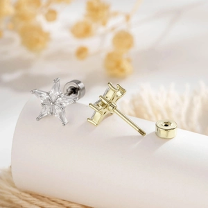 Star shaped gold and silver screw back earrings with kite cut cubic zirconia crystals