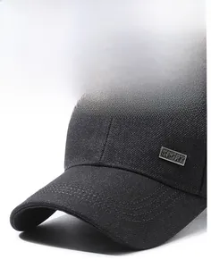 Close-up of black baseball cap featuring SPORT metal badge and reinforced brim stitching