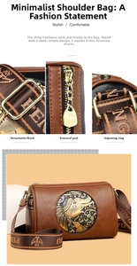 Macro detail of golden zipper and embossed metal elephant emblem on cylinder shoulder bag