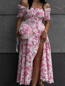 Detail of pink floral dress featuring puff sleeves, drawstring bust, and high side slit
