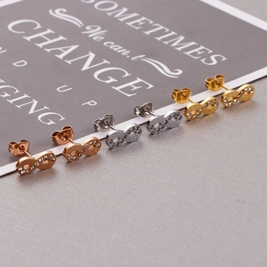 Sparkling infinity symbol stud earrings in gold silver and rose gold with pavé crystals