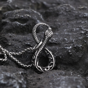 Punk vintage snake pendant necklace in silver metal on black volcanic stone