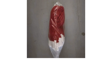 Detail of red and white velvet chair cover fabric textures inside clear plastic packaging