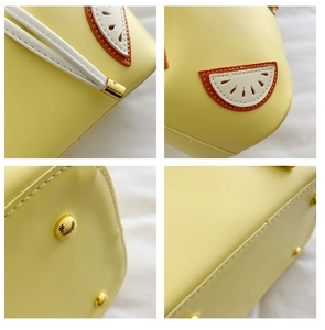 Detail shots of yellow bucket bag showing golden studs, fruit patch, and fine stitching