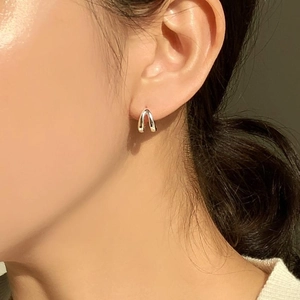 Minimalist double layer silver hoop earrings shown on model for an elegant look