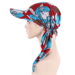 Detail of red floral headscarf cap with blue flower print and back strap tie