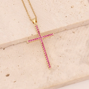 Gold cross necklace featuring micro-paved purple zircon stones on a fine link chain
