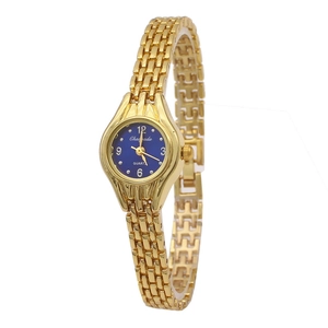 Detail of elegant gold chain watch featuring a deep blue dial and quartz movement