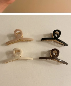 Set of four minimalist twist hair claws in beige, black, white, and dark brown colors