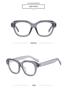 Detail view of square glasses frames with grey transparent layer and white inner material